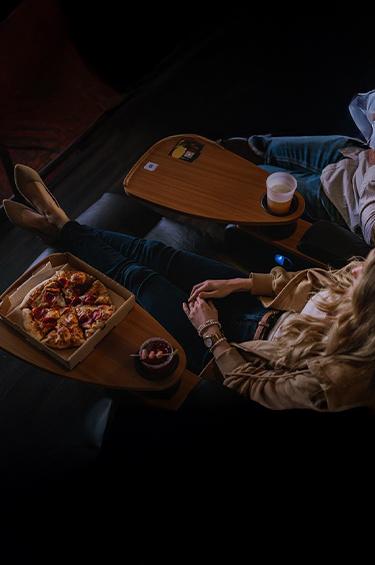 Couple eating at a dine-in theatre Mobile