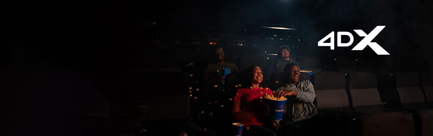 friends experiencing the movement of 4dx, popcorn is spilling everywhere