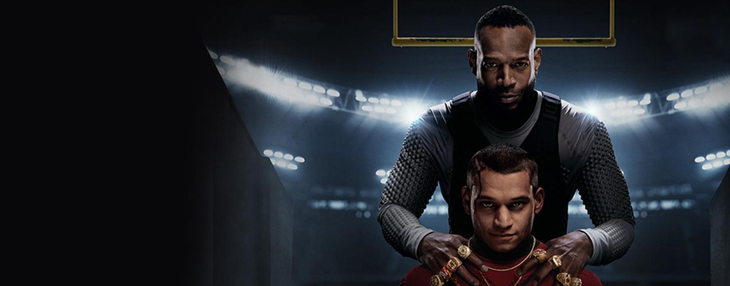 Isaiah standing behind Cam with his hands on his shoulders Desktop