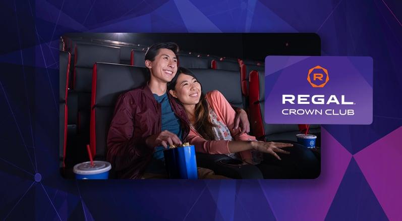 cute couple watching a movie with discounted popcorn