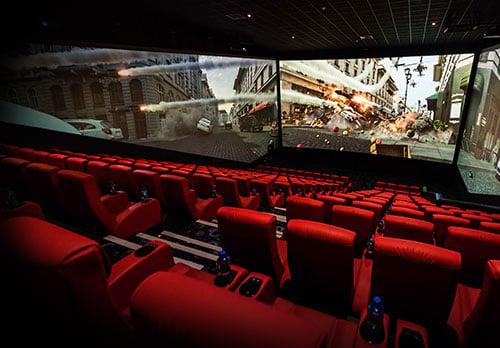 cars and explosions happening on the three screens that surround the ScreenX theatre