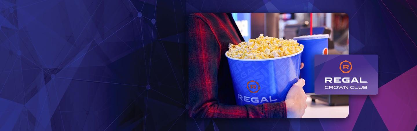popcorn and soda on a purple background with angles that match the regal crown club card