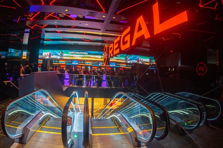 Regal theatre concessions stand from the top of a set of escalators