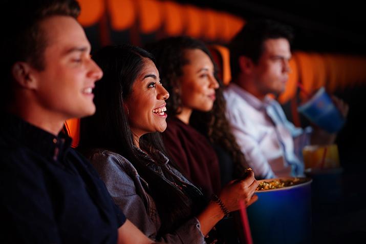 Friends watchng a movie 715x476