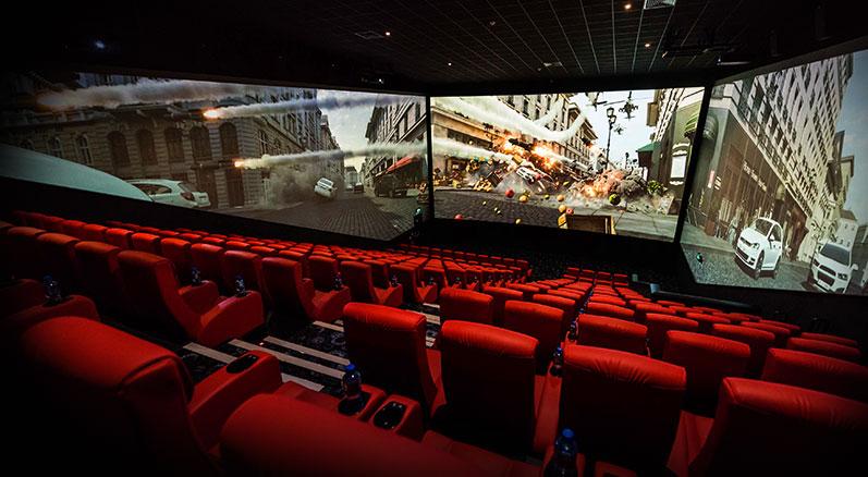 cars and explosions happening on the three screens that surround the ScreenX theatre