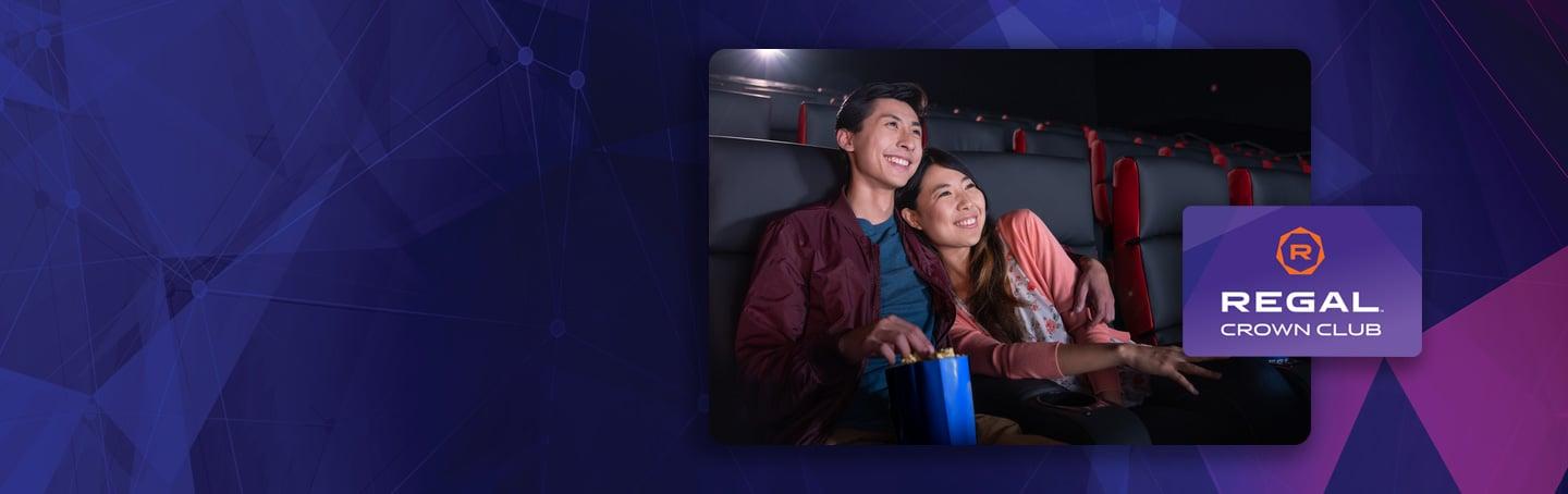 cute couple watching a movie with discounted popcorn